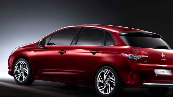Side Back Pose Of 2011 Citroen C4 In Red N Black Background